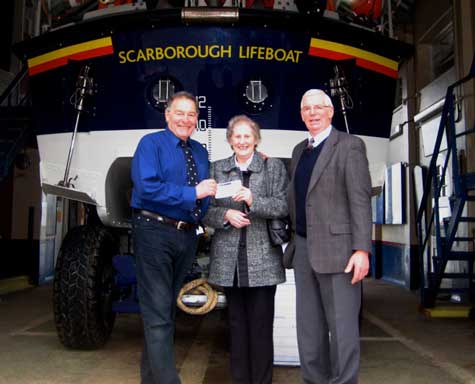 Brian and Rosemarie Raines of Malton present cheques for £400 in celebration of their Golden Wedding Anniversary to Colin Lawson Scarborougnh Lifeboat Operations Manager